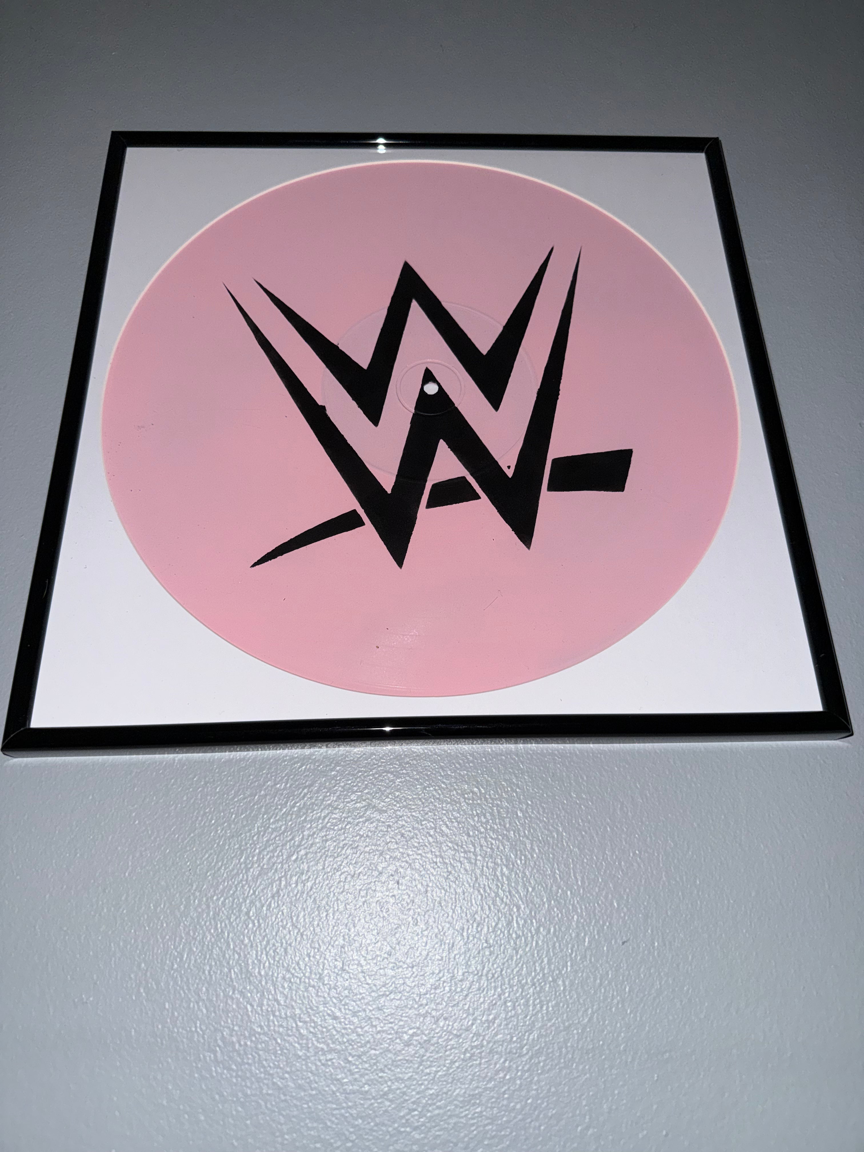 30) WWE Framed Vinyl Art 12” (Imperfect)
